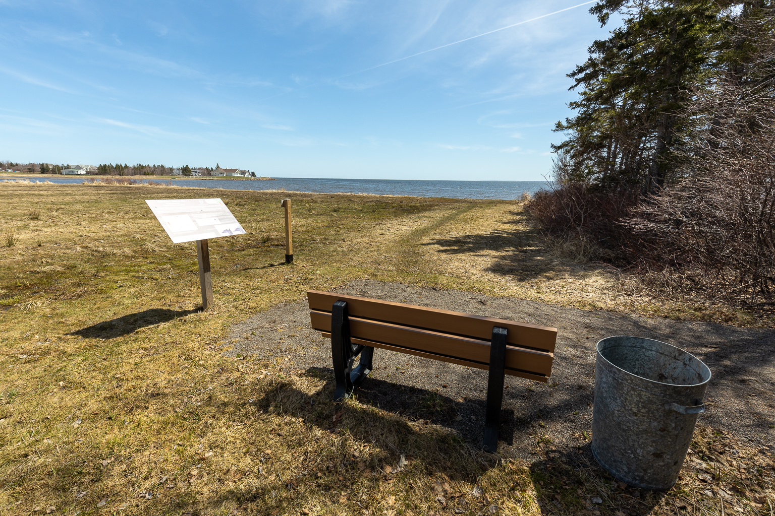 A bench and interpretive sign at the end of the trail